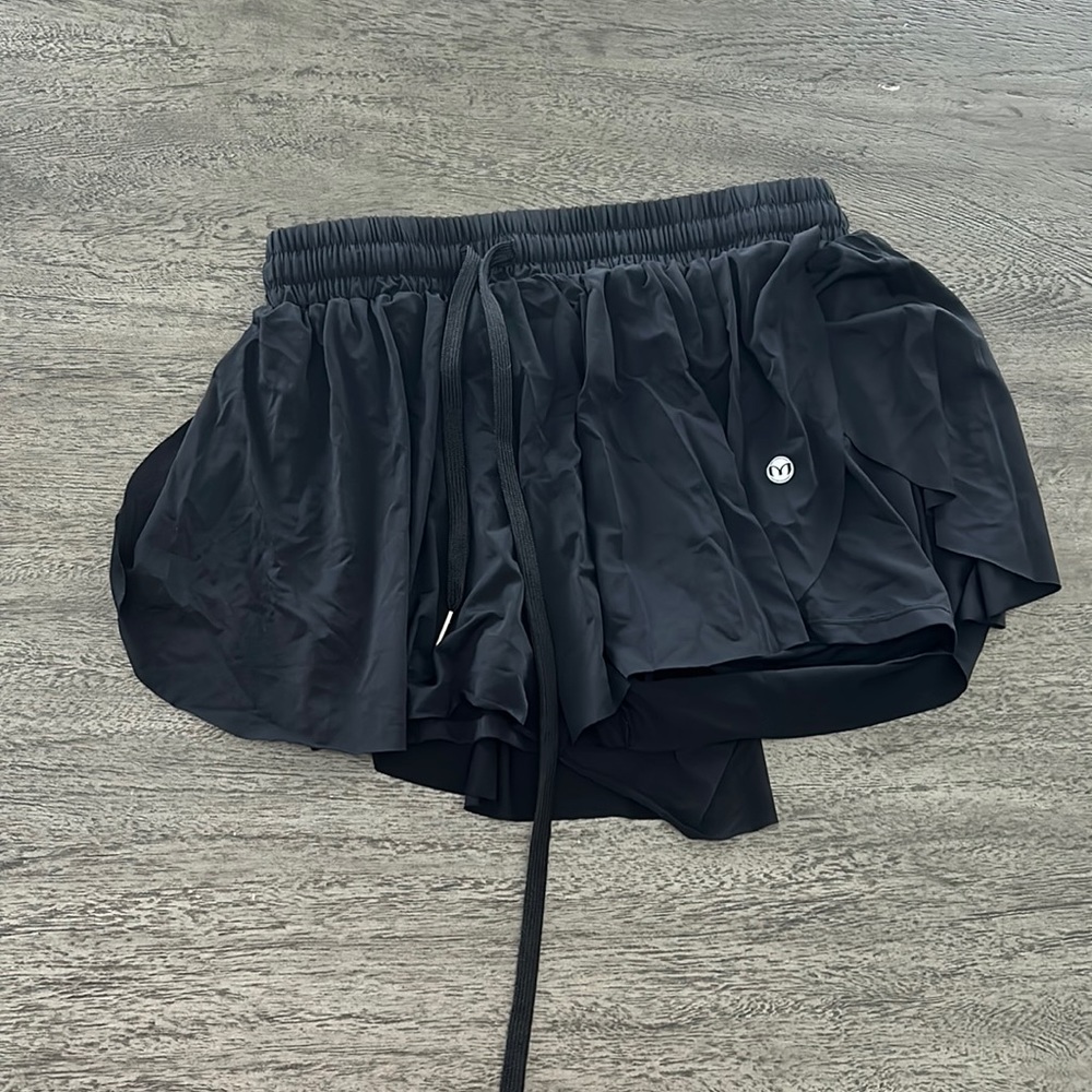 Trendy, flowing shorts and black.